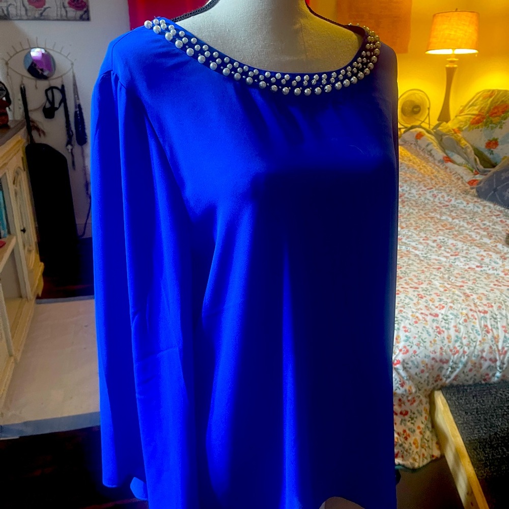 This is a beautiful royal blue blouse with pearls size xl